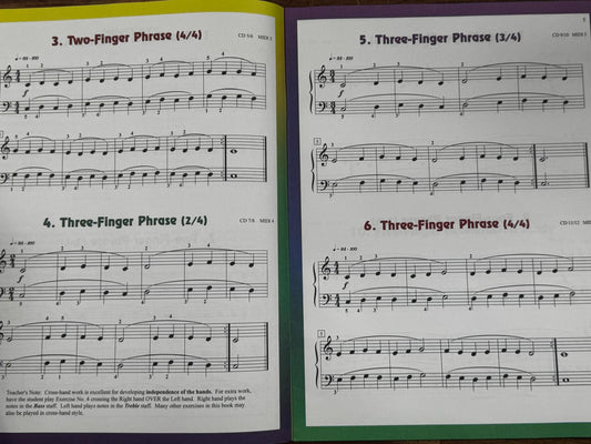 Open music book with sheet music pages on a white background