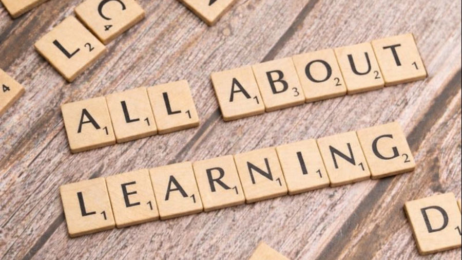 letter tiles spell out ALL ABOUT LEARNING
