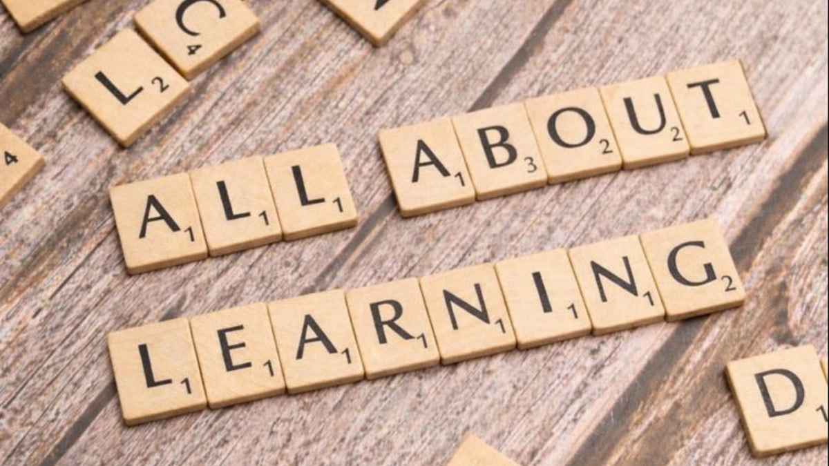 letter tiles spell out ALL ABOUT LEARNING
