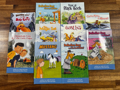 Collection of children's books on a wooden surface