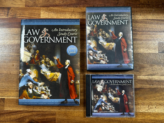 Three books titled 'Law and Government' on a wooden surface