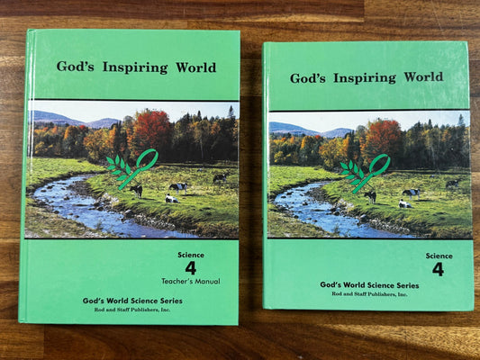 Two green books titled 'God's Inspiring Word' on a wooden surface