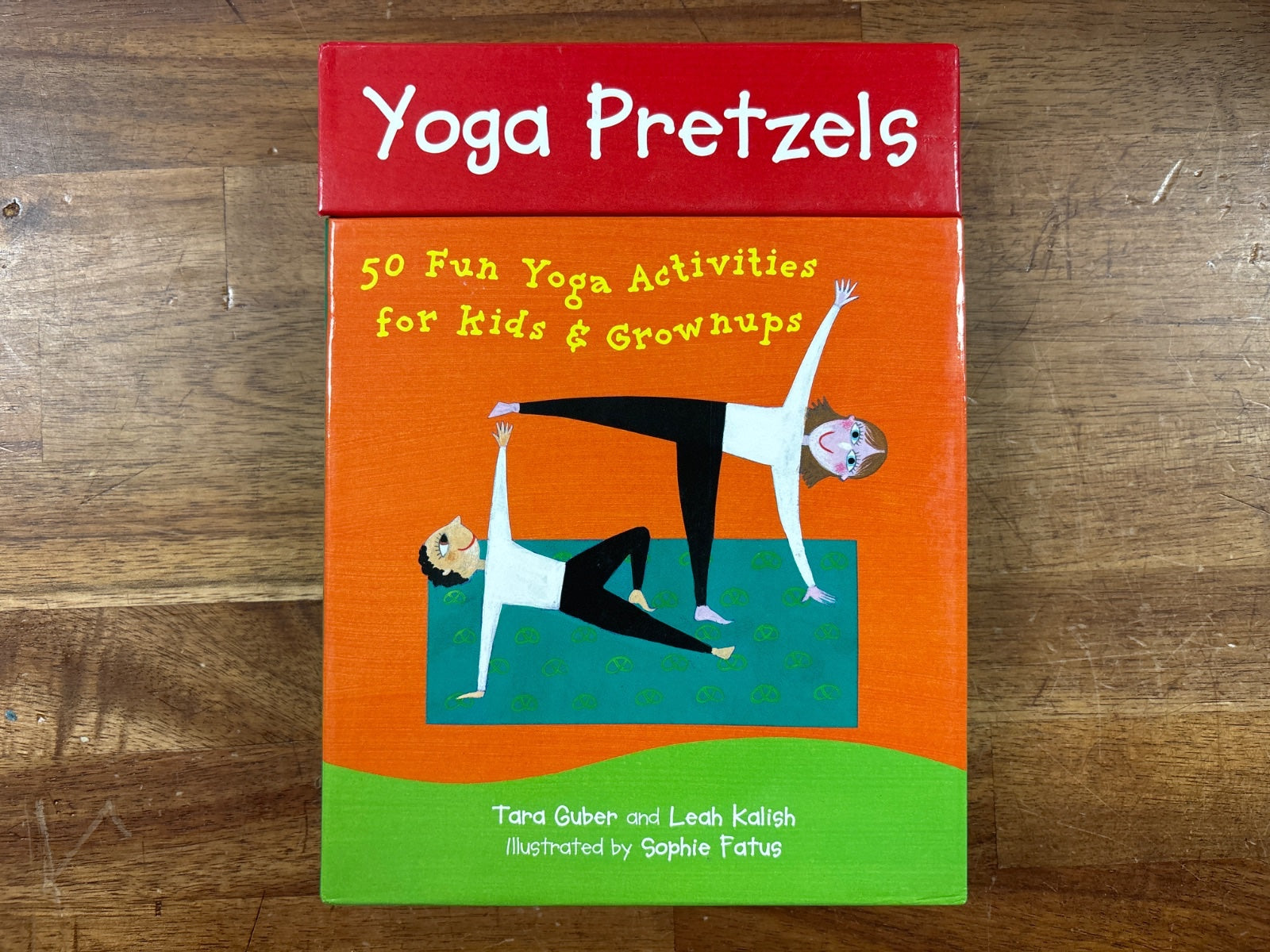 Yoga Pretzels: 50 Fun Yoga Activities for Kids & Grownups Cards — front cover